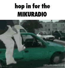 a person is jumping into a green car with the words `` hop in for the mikuradio '' written on it .