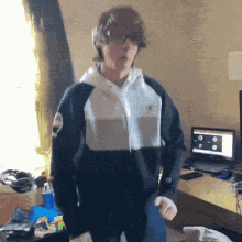 a person wearing a black and white nike sweatshirt