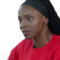 a woman wearing a headband and a red shirt