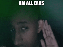 a close up of a person 's face with the words `` am all ears '' written on the bottom .