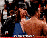 a man in a wrestling ring is asking another man do you like pie