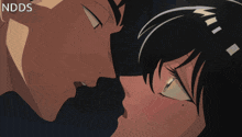 a close up of a man and a woman kissing with ndds written in the corner