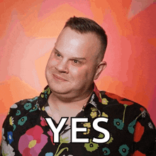 a man in a floral shirt says " yes "