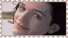 a close up of a woman 's face in a postage stamp frame .