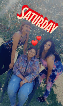 three women posing for a picture with saturday written on the top