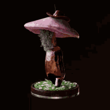 a statue of a mushroom with a hat on it