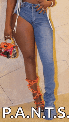 a woman wearing a pair of stacked jeans with p.a.n.t.s. in white letters