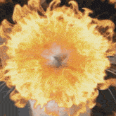 a large explosion of flames is coming out of a container