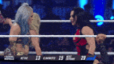 two women in a wrestling ring with the words royal rumble in the corner