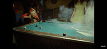 a pool table with smoke coming out of it and the words vevo on the bottom
