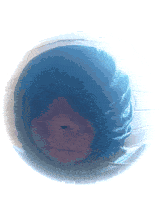 a person 's face is visible through a hole in a sphere