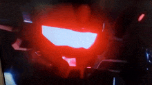 a close up of a red light on a screen
