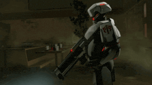 a robot is holding a large gun with the number 21 on it