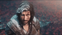 a man with long hair and a beard is wearing a fur collar