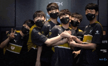 a group of young men wearing masks and shirts with gp on them