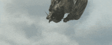 a person is falling through the air with a sword in their hand .