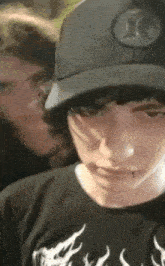 a person wearing a hat with a x on it