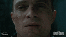 a close up of a man 's face with the words daredevil born again on the bottom right