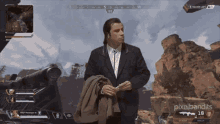a man in a suit is standing in front of a screen that says pixelbandits on it