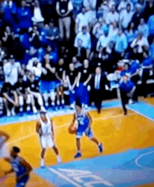 a basketball game is being played in front of a crowd with the word miami on the court
