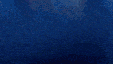 a dark blue background with a few stars on it