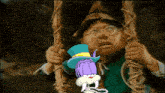 a man with glasses is holding a rope with a cartoon character in a top hat behind him