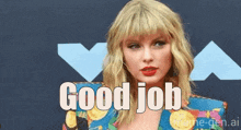 taylor swift is standing on a red carpet with the words `` good job '' written on it .