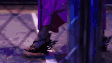 a woman in a purple dress is wearing a pair of black shoes with flames on them .