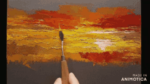 a painting is being painted on a canvas and made in animatica
