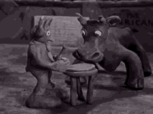 a black and white cartoon of a man standing next to a rhinoceros .