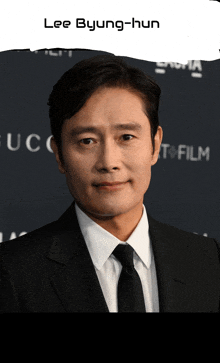 a man in a suit and tie with the name lee byung-hun