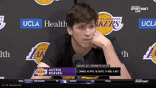 a lakers player named austin reaves is talking to a reporter
