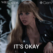 a woman says it 's okay while wearing a black jacket
