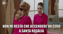 two women are sitting next to each other with the words non mi resta che accendere un cero a santa rosalia