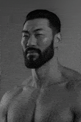a man with a beard has his eyes closed