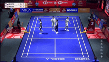 a badminton game is being played in jakarta