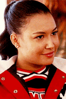 a close up of a woman wearing a cheerleader outfit