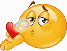 a cartoon smiley face is blowing a kiss and holding a red heart