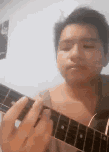 pandilijan strumming playing guitar middle finger flipping off