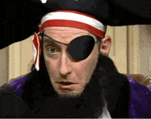 a man wearing a pirate hat and eye patch