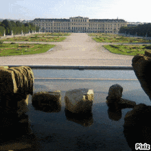a picture of a large building with pixiz written on the bottom right
