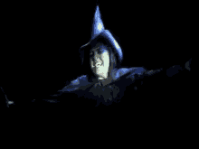 the wicked witch from the wizard of oz is being projected on a screen