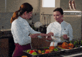 a woman in a chef 's jacket has the number 11 on her chest