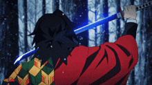 a man in a red jacket is holding a blue sword in front of a snowy forest