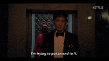 a man in a tuxedo with the number 456 on his chest is saying i 'm trying to put an end to it