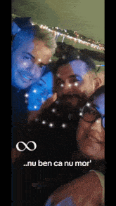 a group of people are posing for a picture with an infinity symbol on the bottom