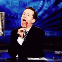 Stephen Colbert Lollipop GIF - Stephen Colbert Lollipop Eating Lollipop GIFs