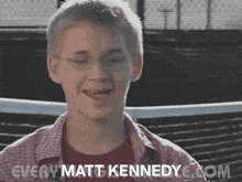 a young man wearing glasses says " every matt kennedy " on the bottom