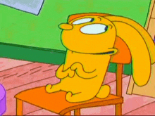 a cartoon rabbit is sitting on a chair with its legs crossed .