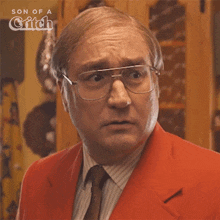 a man wearing glasses and a red suit is featured in a son of a grifch poster